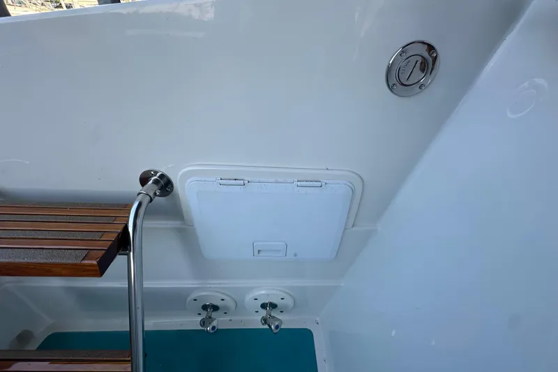 Slide: The Image of 1972 Tollycraft 42 Tri-Cabin boat interior with wooden steps and access panel. - 9