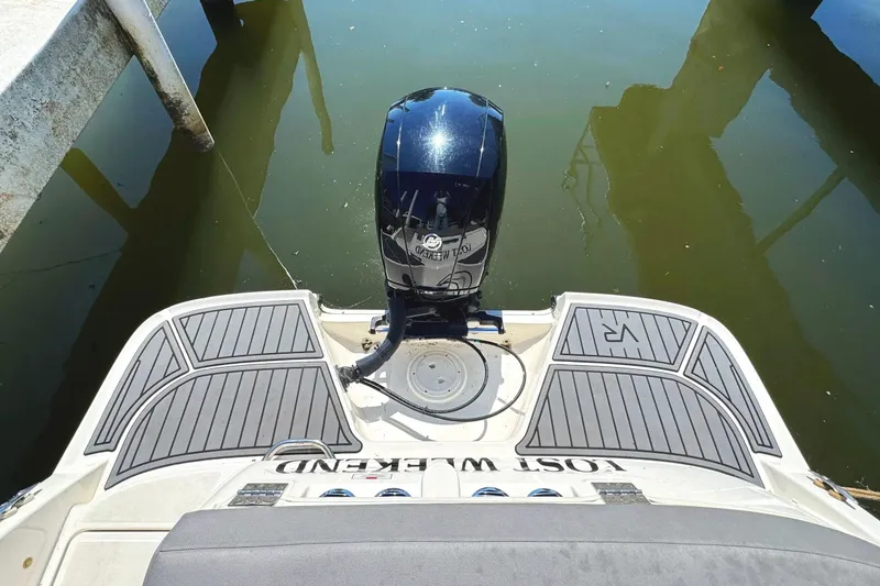 Slide: The Image of 2022 Bayliner VR6 Bowrider OB with outboard motor, docked on calm water. - 23
