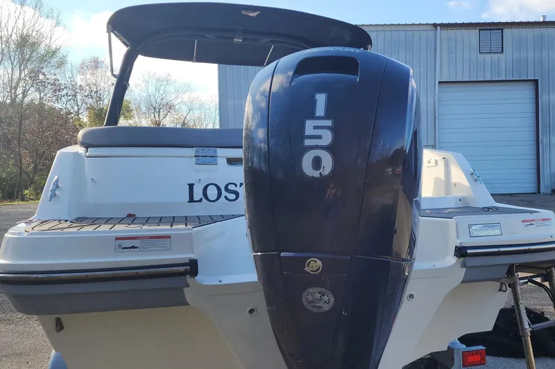 Slide: The Image of 2022 Bayliner VR6 Bowrider OB with 150 HP outboard engine, docked outdoors. - 28