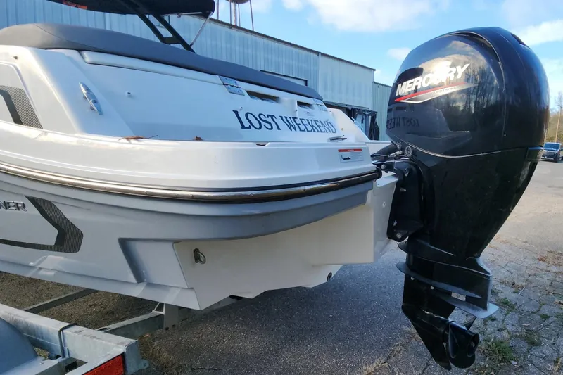 Slide: The Image of 2022 Bayliner VR6 Bowrider OB with Mercury outboard motor, parked outdoors. - 29