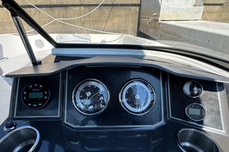 Slide: The Image of 2022 Bayliner VR6 Bowrider OB dashboard with gauges and controls. - 7