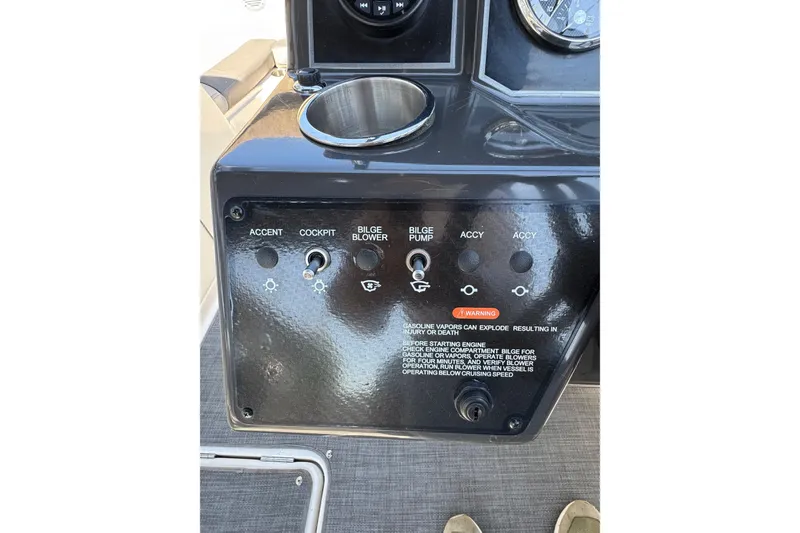 Slide: The Image of Control panel of 2022 Bayliner VR6 Bowrider OB with switches and warning label. - 8