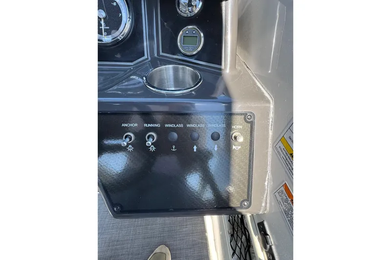 Slide: The Image of Control panel of 2022 Bayliner VR6 Bowrider OB with switches and gauges. - 9