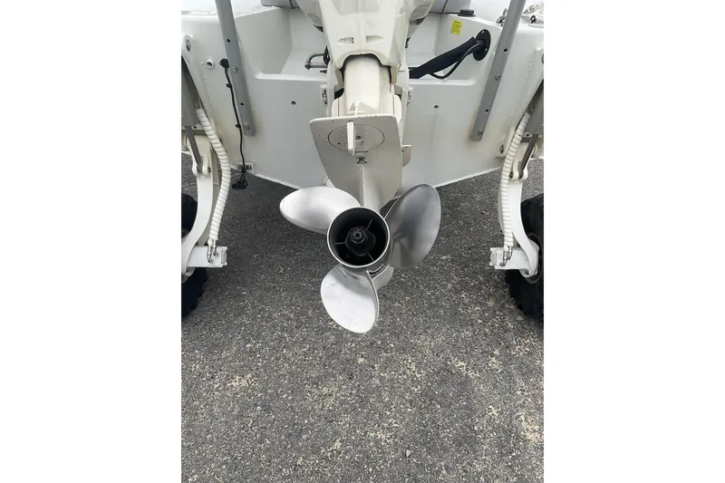 Slide: The Image of Propeller of 2011 Sealegs 7.1 amphibious boat on pavement. - 12