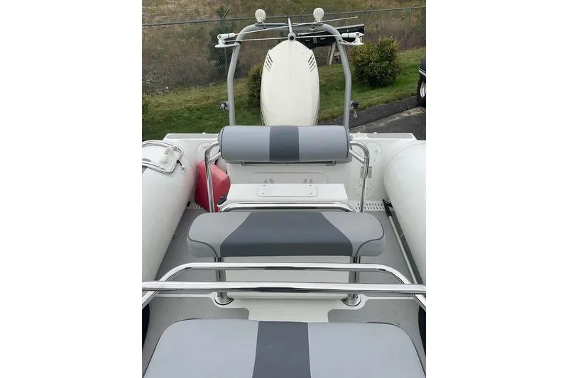 Slide: The Image of 2011 Sealegs 7.1 boat interior with gray seating and metal railings. - 4