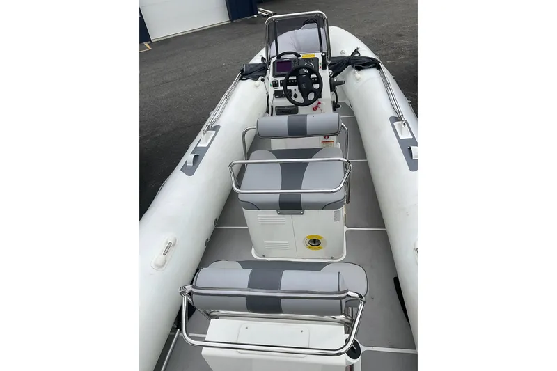 Slide: The Image of 2011 Sealegs 7.1 boat interior with seating and steering console. - 6