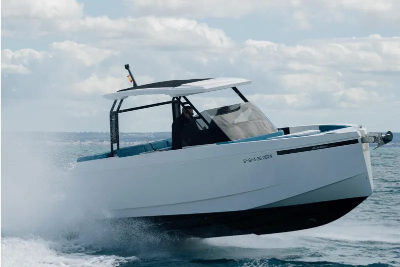 The Image of 2026 De Antonio Yachts D29 cruising on open water under a cloudy sky. - 0