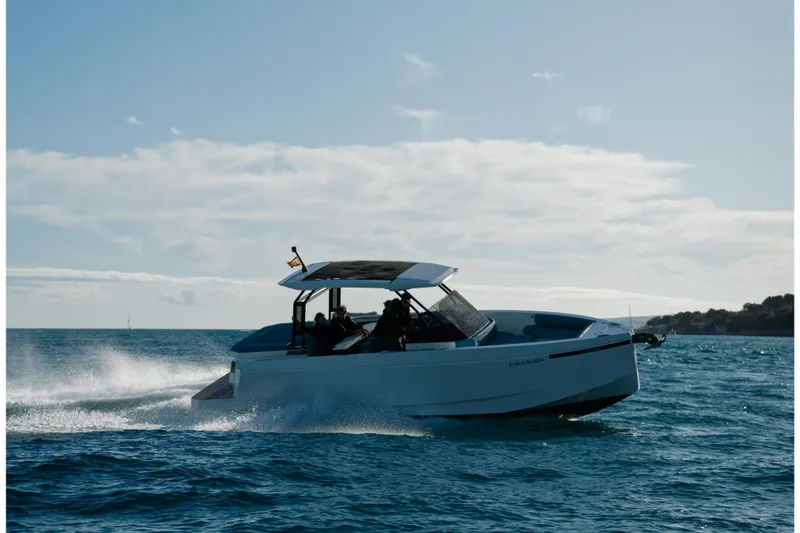 Slide: The Image of 2026 De Antonio Yachts D29 cruising on open water under cloudy skies. - 1