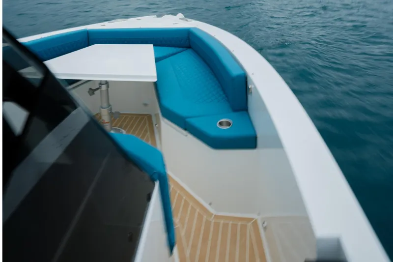 Slide: The Image of 2026 De Antonio Yachts D29 cruising on open water, aerial view. - 10