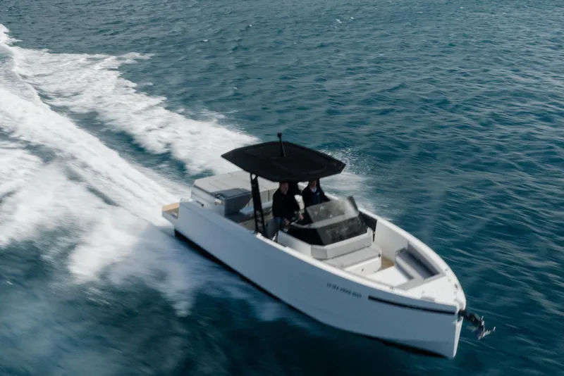 Slide: The Image of 2026 De Antonio Yachts D29 cruising on open water under clear skies. - 3