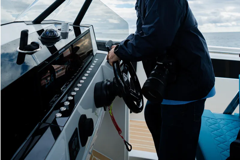 Slide: The Image of 2026 De Antonio Yachts D29 cruising on clear turquoise waters, aerial view. - 8