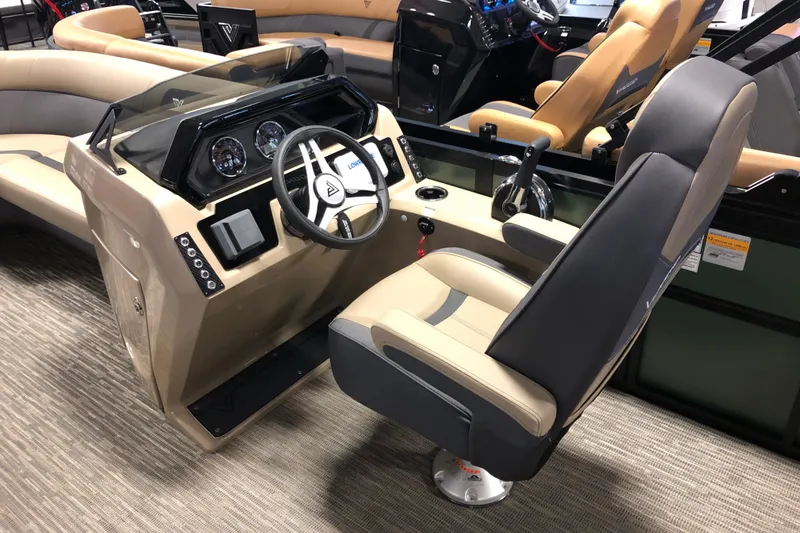 Slide: The Image of Interior of 2026 Viaggio X22S boat with modern steering console and seating. - 11