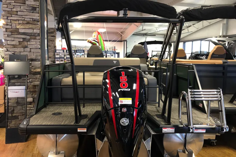 Slide: The Image of 2026 Viaggio X22S pontoon boat with powerful 150 Pro engine in showroom. - 2