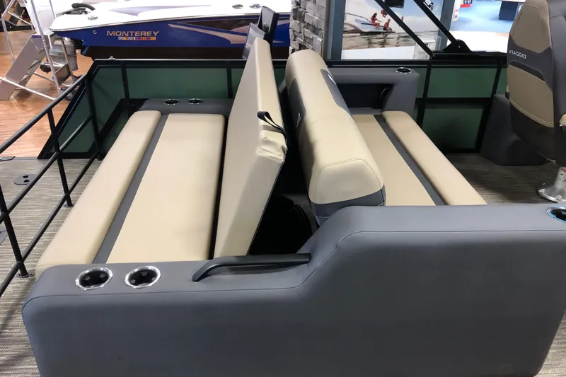 Slide: The Image of 2026 Viaggio X22S boat interior with beige seating and cup holders. - 9