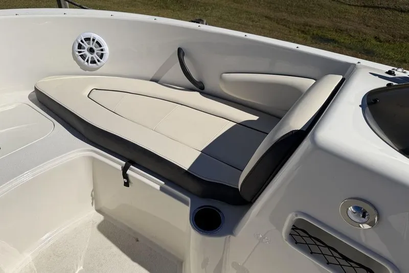 Slide: The Image of 2023 Stingray 172SC boat interior with cushioned seating and speaker. - 13