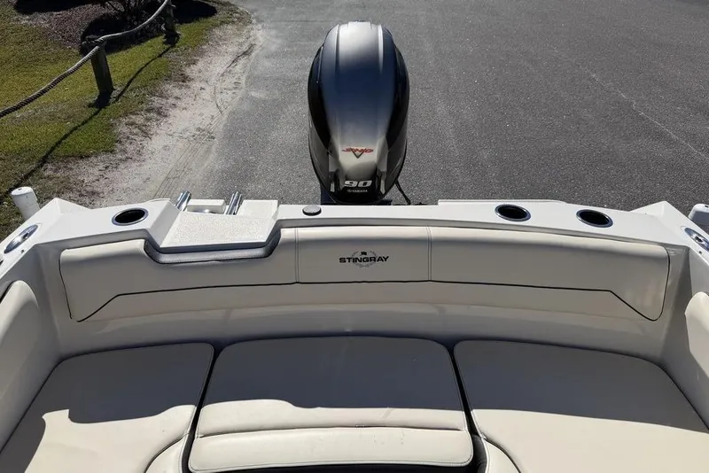 Slide: The Image of 2023 Stingray 172SC boat interior with Yamaha 90 engine, featuring comfortable seating. - 18