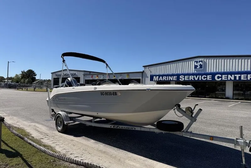 Slide: The Image of 2023 Stingray 172SC boat on trailer outside Marine Service Center. - 7