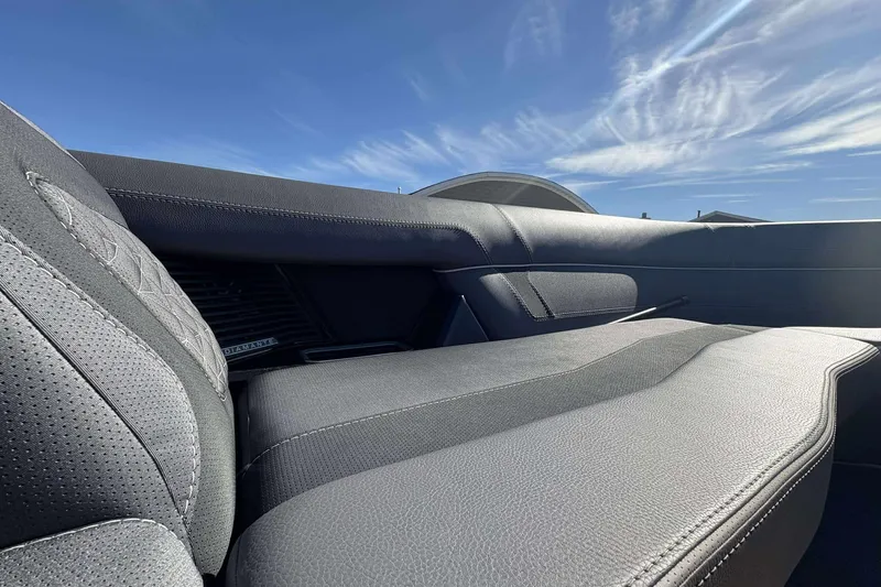 Slide: The Image of 2025 Viaggio D26U interior with sleek, modern design and premium leather seats under a clear sky. - 12