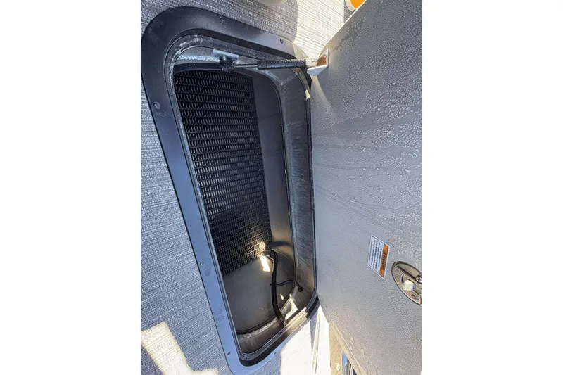 Slide: The Image of Open storage compartment in 2025 Viaggio D26U vehicle, featuring textured interior. - 15