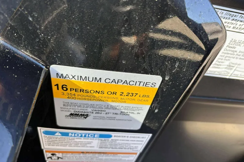 Slide: The Image of Label on Viaggio D26U boat showing maximum capacity of 16 people or 2,237 lbs. - 23