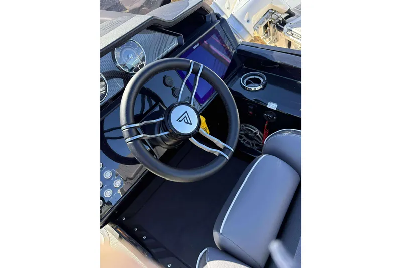 Slide: The Image of 2025 Viaggio D26U boat dashboard with steering wheel and modern controls. - 7