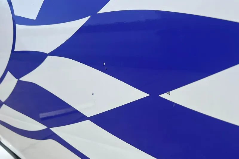 Slide: The Image of White and pink seating on a 1996 Baja .38 Special boat. - 104