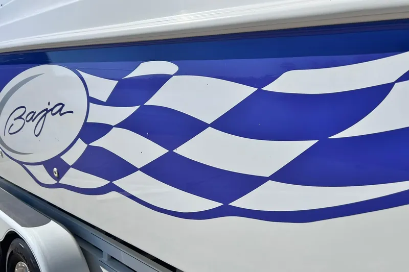 Slide: The Image of 1996 Baja .38 Special boat with blue and white checkered design. - 12