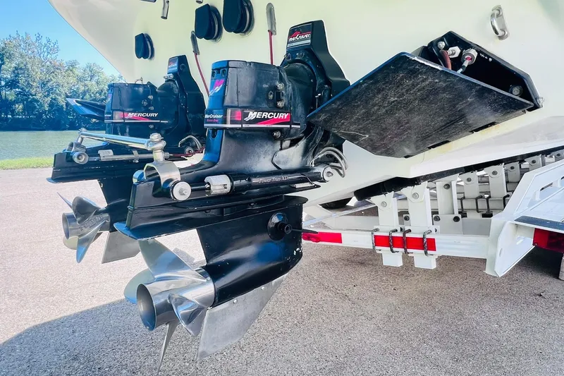 Slide: The Image of 1996 Baja .38 Special boat with dual Mercury outboard engines on a trailer. - 22