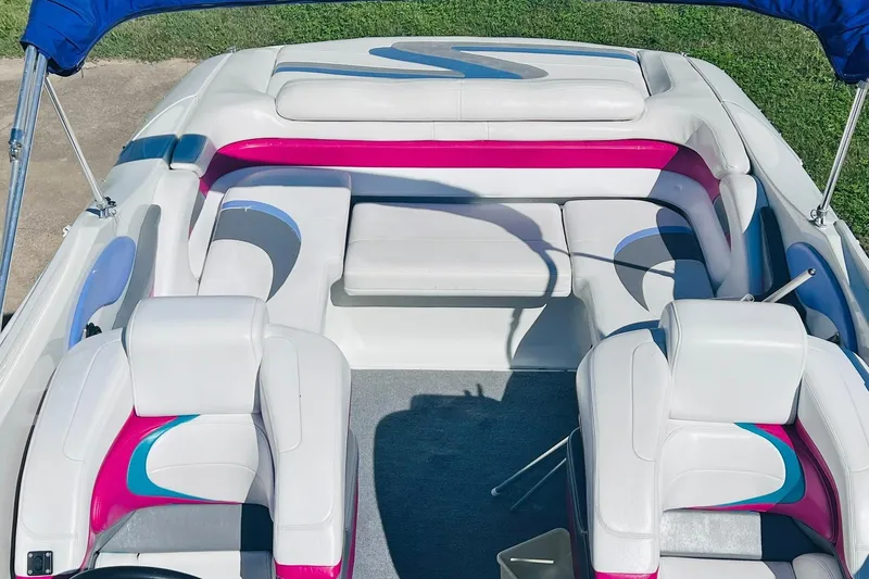 Slide: The Image of Interior of a 1996 Baja .38 Special boat with white and pink seating. - 33