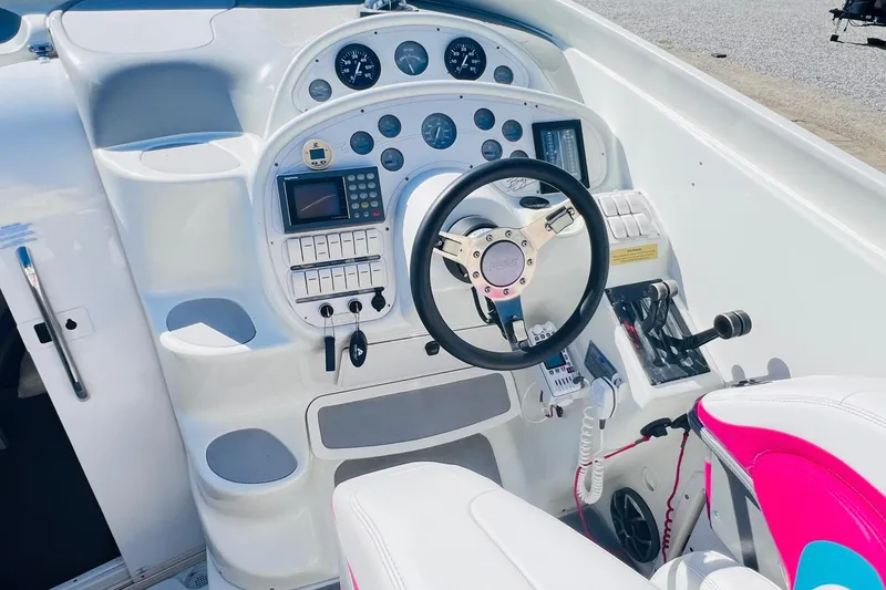 Slide: The Image of 1996 Baja .38 Special boat cockpit with steering wheel and control panel. - 35