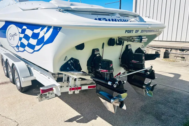 Slide: The Image of 1996 Baja .38 Special boat with dual Mercury engines on a trailer. - 4
