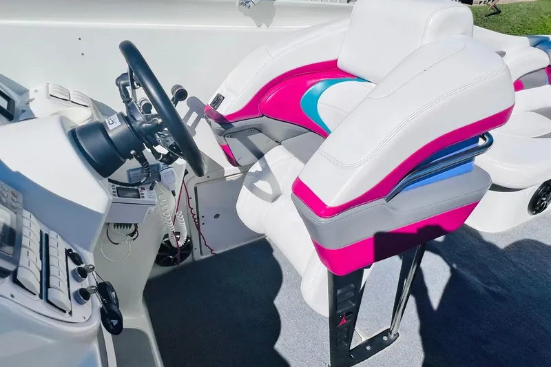Slide: The Image of Interior of a 1996 Baja .38 Special boat with vibrant seating and steering controls. - 41