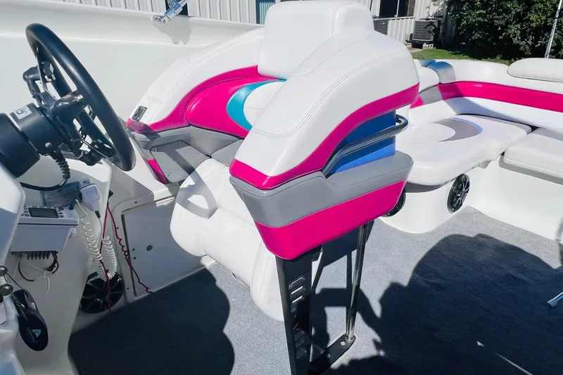 Slide: The Image of Interior of a 1996 Baja .38 Special boat with vibrant seating and steering wheel. - 43