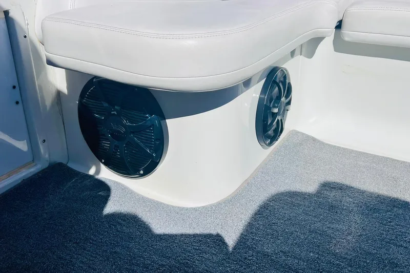 Slide: The Image of Interior of a 1996 Baja .38 Special boat with speakers and cushioned seating. - 47