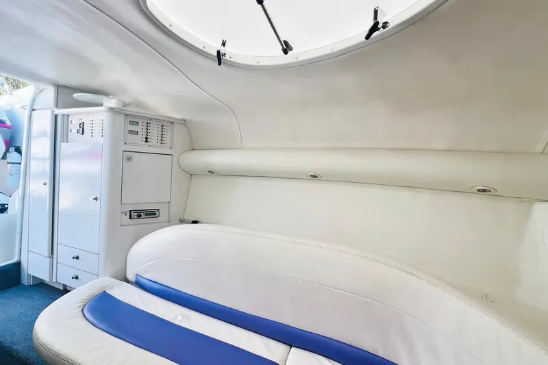 Slide: The Image of Interior of a 1996 Baja .38 Special boat with white and purple seating. - 59