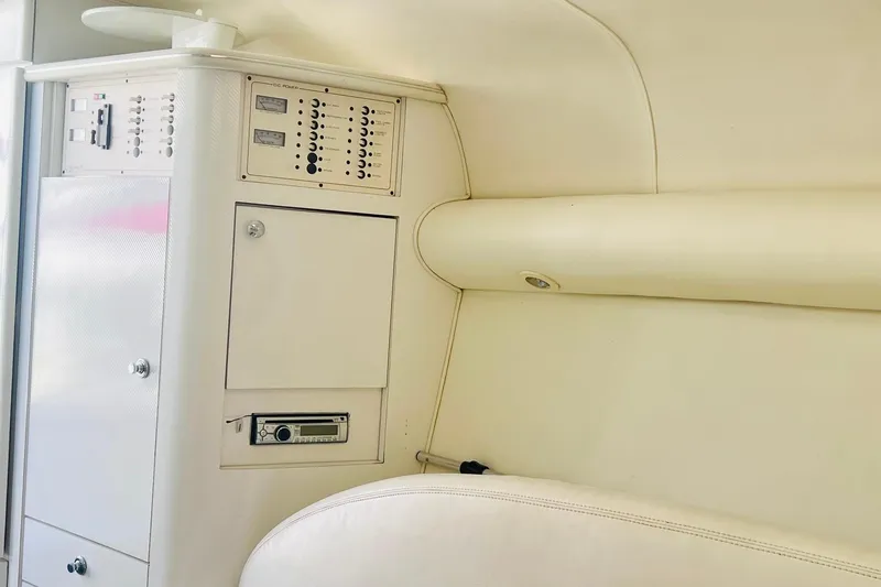 Slide: The Image of Interior of a 1996 Baja .38 Special boat, featuring a white cabin ceiling and hatch. - 62