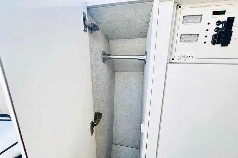 Slide: The Image of Compact bathroom in a 1996 Baja .38 Special boat, featuring a sink and toilet. - 67