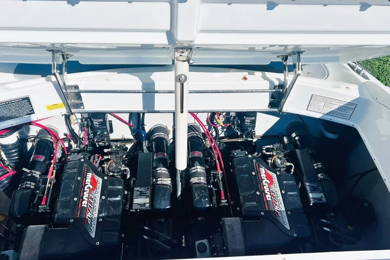 Slide: The Image of 1996 Baja .38 Special boat engine compartment with twin MerCruiser engines, open hatch. - 72