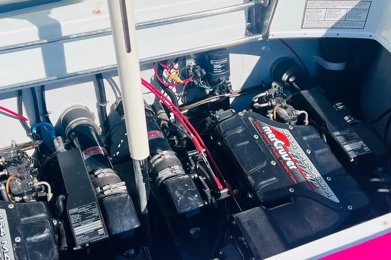 Slide: The Image of Engine compartment of a 1996 Baja .38 Special boat with twin Mercury engines. - 74