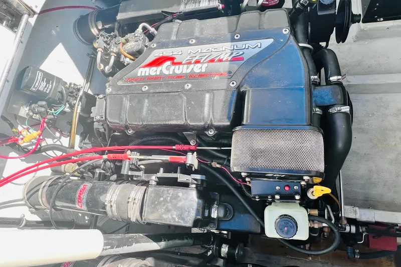 Slide: The Image of Engine cover of a 1996 Baja .38 Special with MerCruiser 454 Magnum EFI. - 79