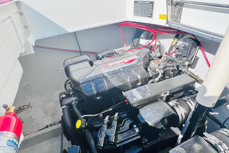 Slide: The Image of Engine compartment of a 1996 Baja .38 Special boat with visible fire extinguisher. - 82