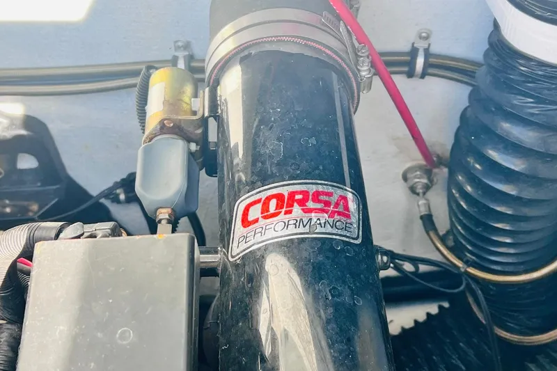 Slide: The Image of Engine compartment of a 1996 Baja .38 Special boat with visible fire extinguisher. - 83