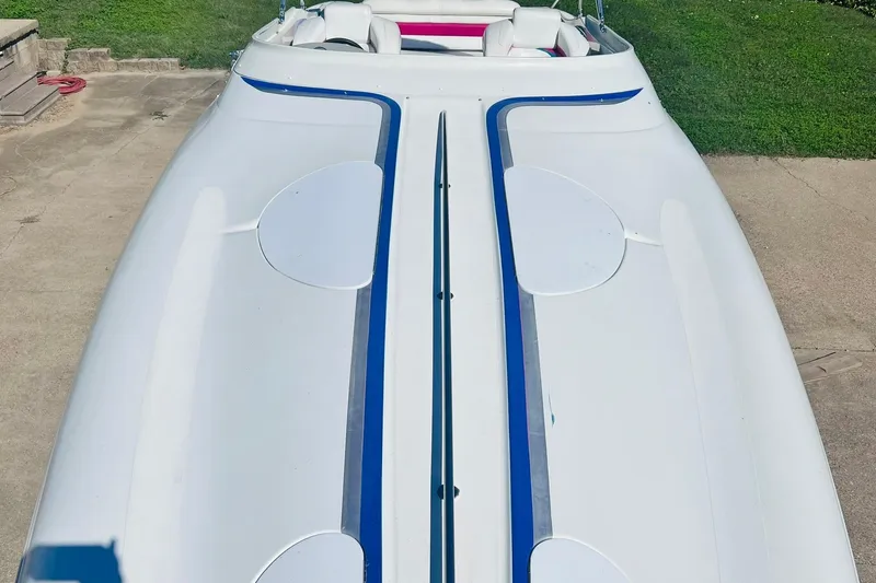 Slide: The Image of Engine component of a 1996 Baja .38 Special boat with wiring and fluid reservoir. - 86