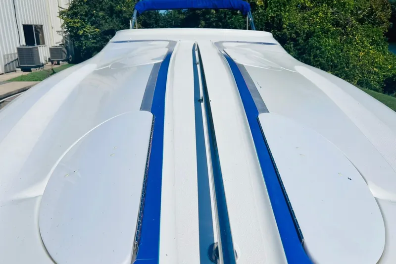 Slide: The Image of Engine compartment of a 1996 Baja .38 Special boat with MerCruiser components. - 87