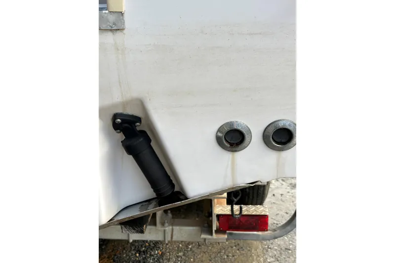 Slide: The Image of 2001 Grady-White Express 265 boat transom with fittings and trailer detail. - 13