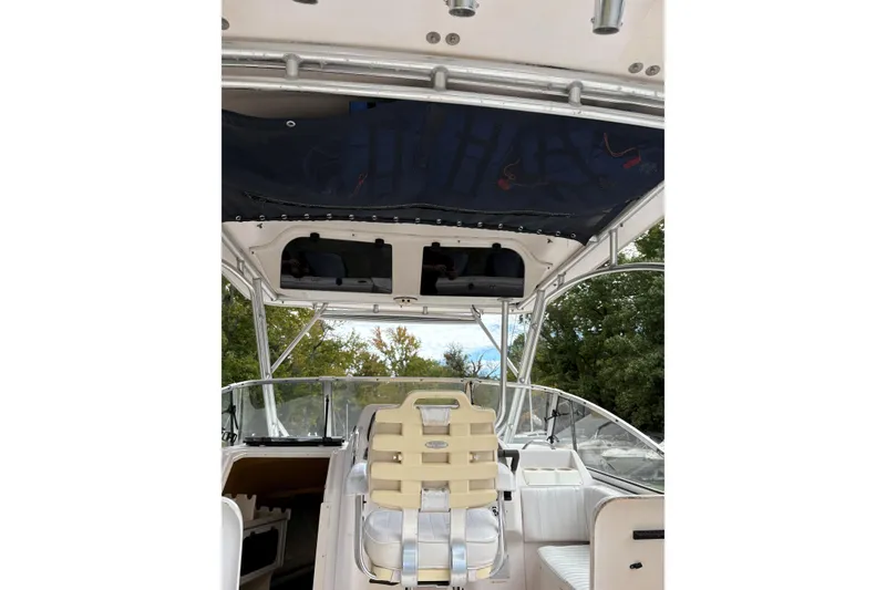 Slide: The Image of 2001 Grady-White Express 265 boat interior with seating and canopy. - 18