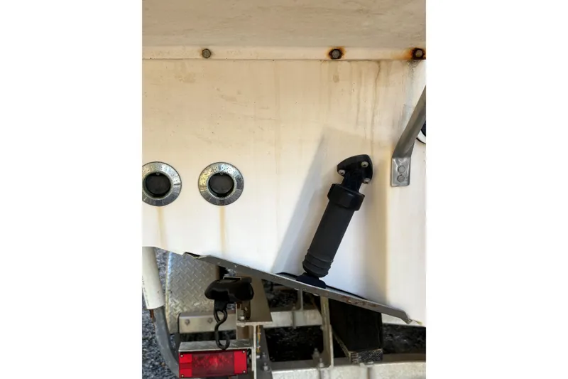 Slide: The Image of Rear view of a 2001 Grady-White Express 265 boat, showing exhaust ports and fittings. - 19