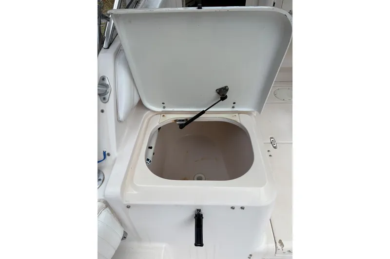 Slide: The Image of Open storage compartment on 2001 Grady-White Express 265 boat. - 28