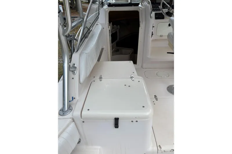 Slide: The Image of 2001 Grady-White Express 265 boat interior with seating and storage compartments. - 29