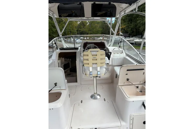 Slide: The Image of 2001 Grady-White Express 265 boat interior with helm and seating area. - 32